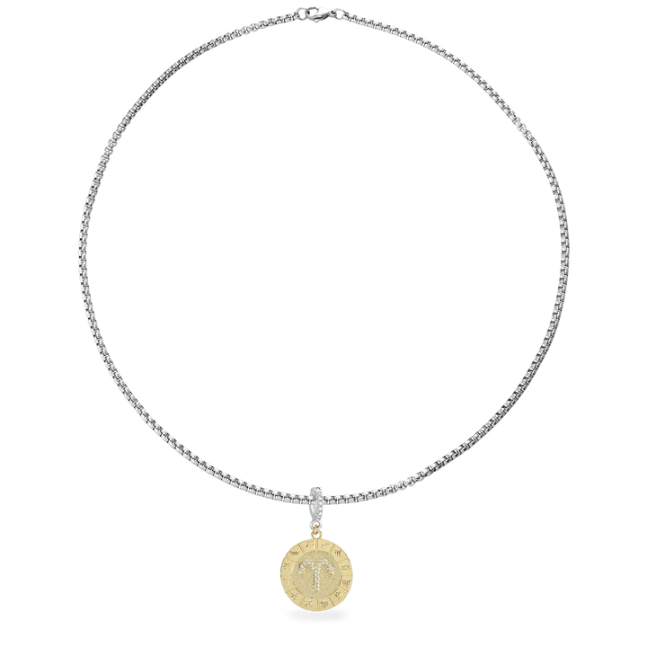 A silver necklace with The Zodiac Clip On Charm, a gold charm with the Aries zodiac symbol and cubic zirconia accents. ||| TAURUS/MIX