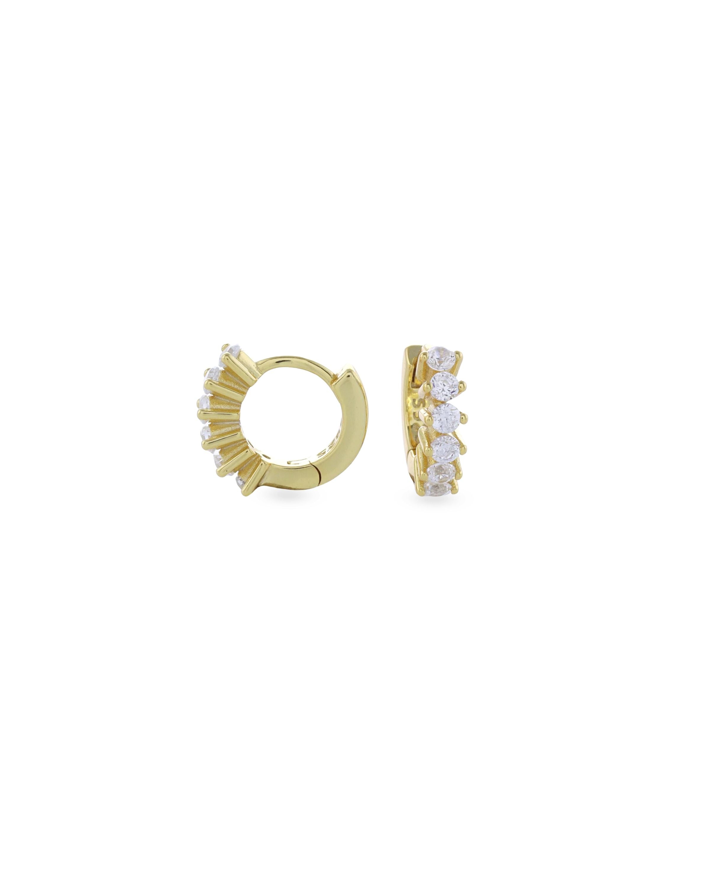 The Tiny Huggies Hoop, a pair of small gold hoop earrings that feature a row of sparkling cubic zirconia stones set in a  pointed, triangular pattern. ||| GOLD/5mm