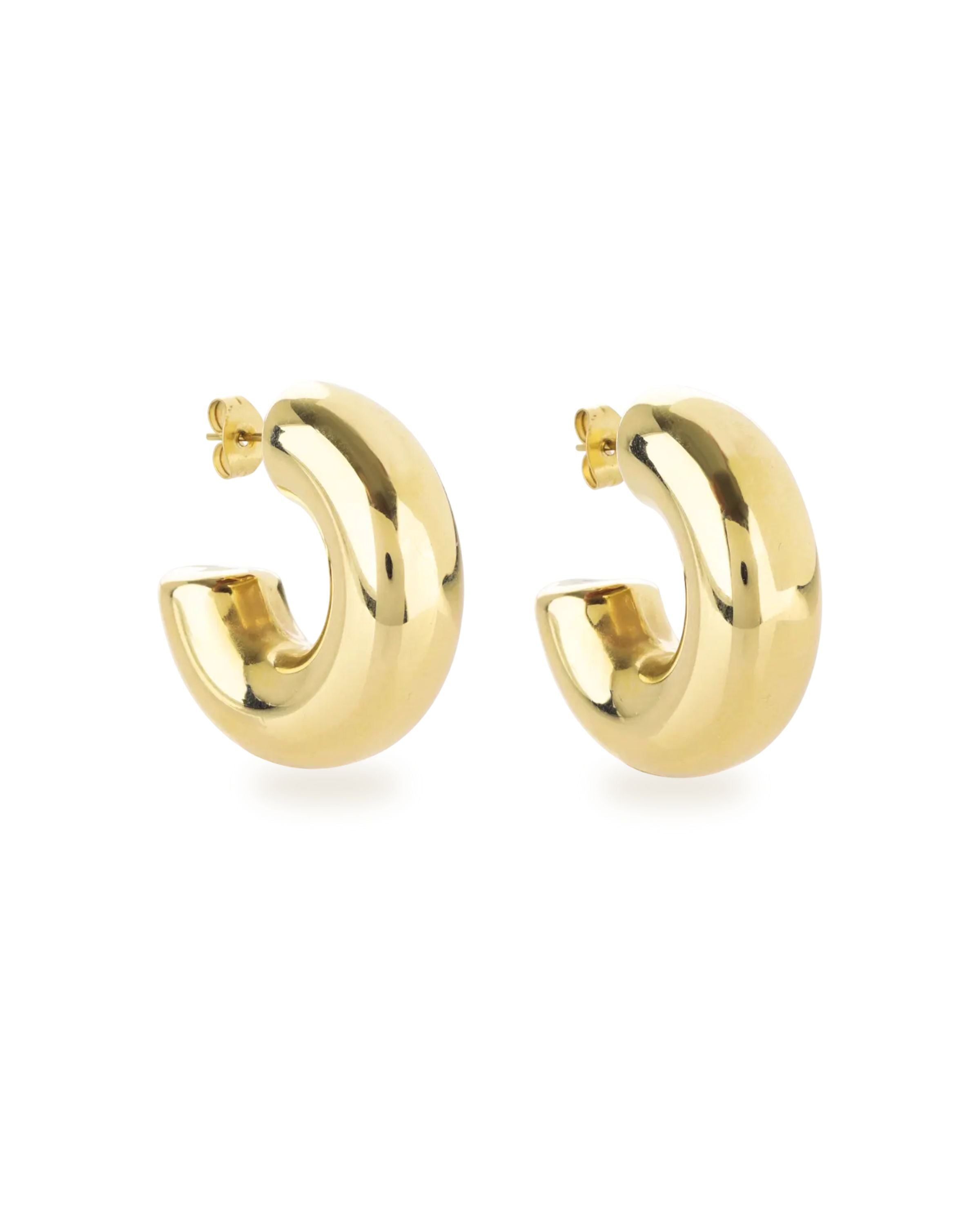 The Bagel Hoop, a pair of chunky gold hoop earrings with a rounded, torus shape.