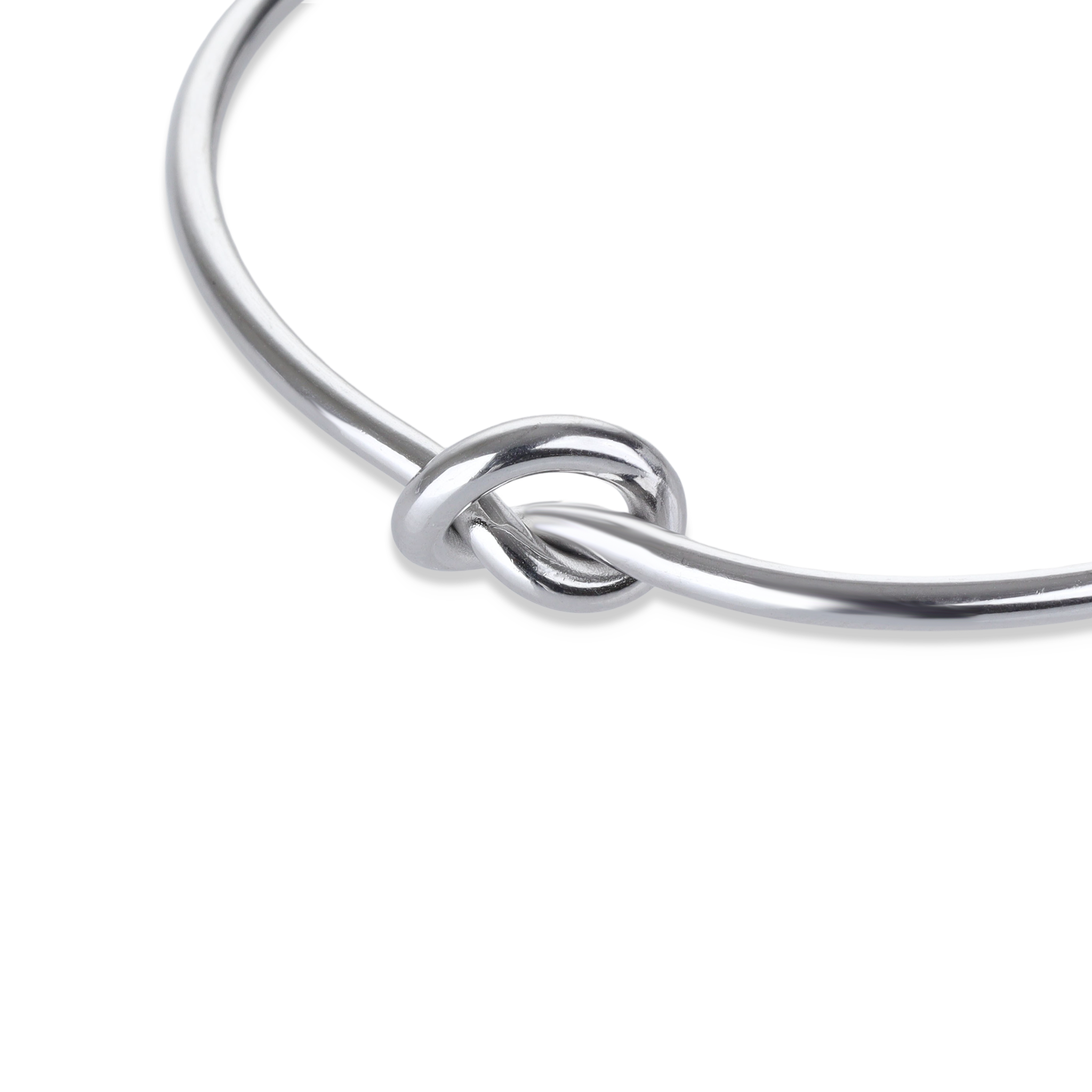 The KNOT, a single elegant silver open cuff bracelet featuring a stylish knot detail at the center, designed for a minimalist and refined look ||| SILVER
