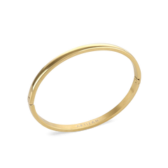 The Plain Bangle, which is a single-piece gold bangle, features a smooth and polished finish, offering a timeless and minimalist style that works perfectly on its own or stacked with other bangles for an elegant touch. ||| GOLD