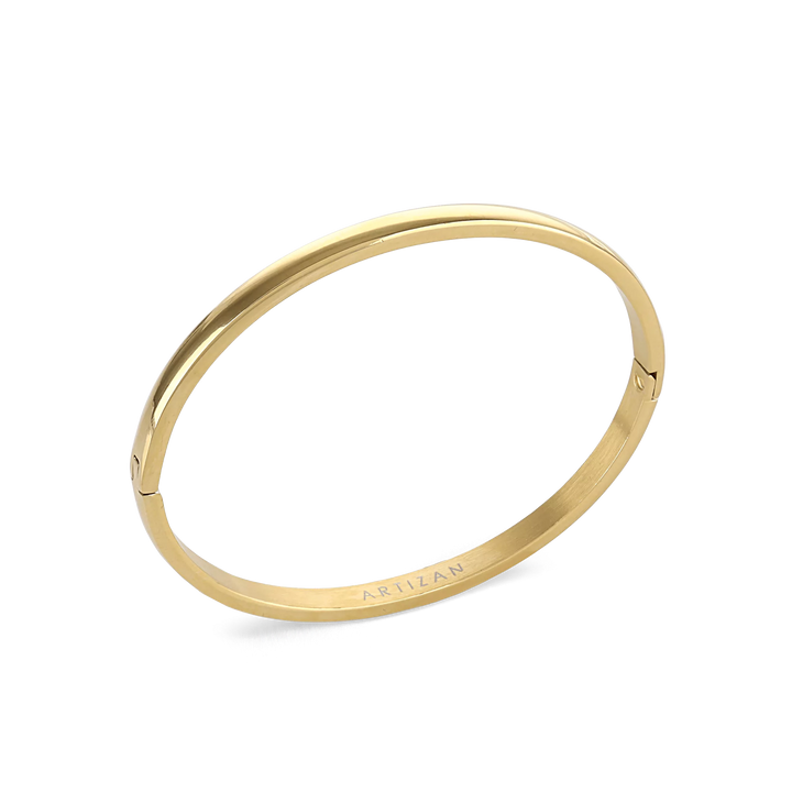 The Plain Bangle, which is a single-piece gold bangle, features a smooth and polished finish, offering a timeless and minimalist style that works perfectly on its own or stacked with other bangles for an elegant touch. ||| GOLD