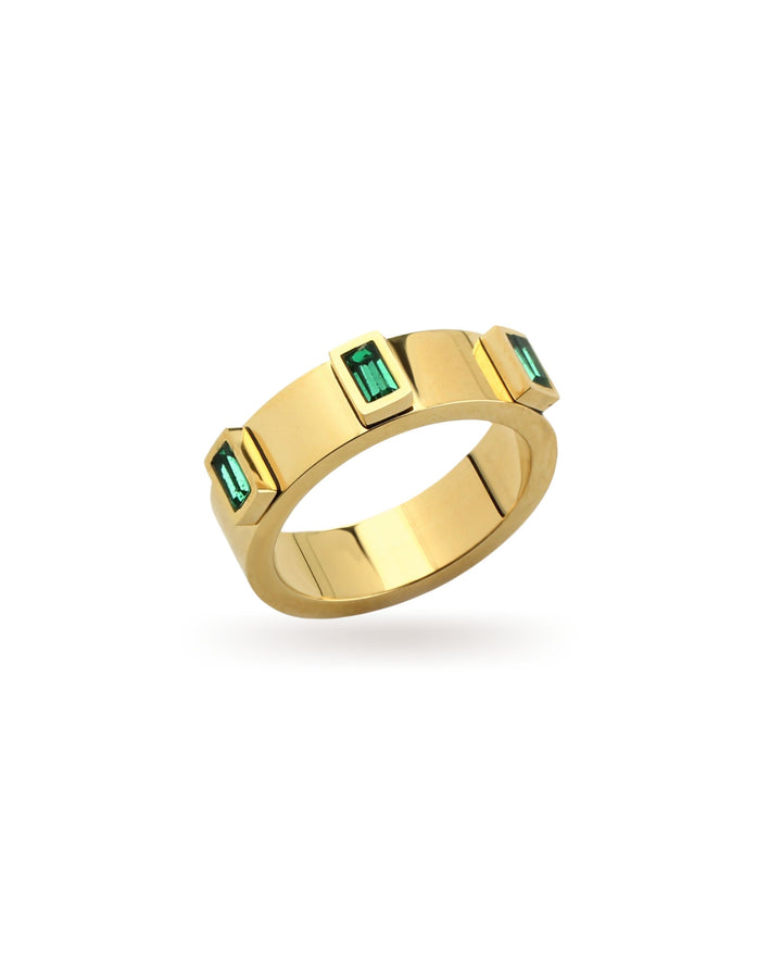 The Emerald Ring, a gold ring adorned with rectangular emerald green gemstones.
