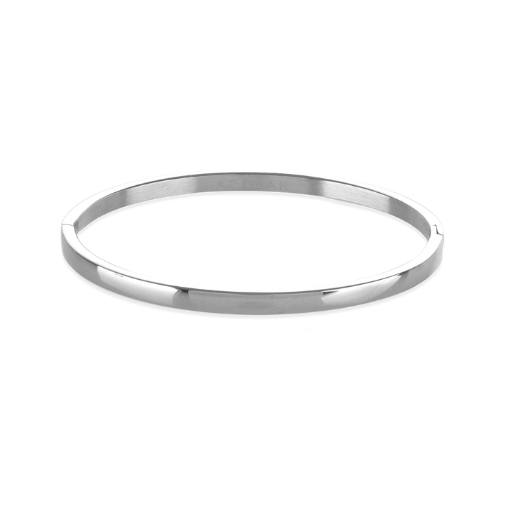 The Plain Bangle, which is a single-piece silver bangle, features a sleek and polished finish, offering a minimalist and timeless design perfect for everyday wear or stacking with other bracelets for a modern, chic look. ||| SILVER
