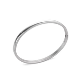 The Plain Bangle, which is a single-piece silver bangle, features a sleek and polished finish, offering a minimalist and timeless design perfect for everyday wear or stacking with other bracelets for a modern, chic look. ||| SILVER