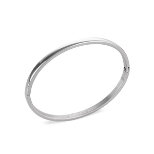 The Plain Bangle, which is a single-piece silver bangle, features a sleek and polished finish, offering a minimalist and timeless design perfect for everyday wear or stacking with other bracelets for a modern, chic look.