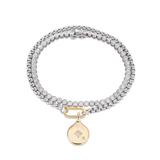 The Tennis and the Box Bracelet Set, a two-piece silver bracelet set featuring a diamond-like tennis bracelet and a box chain bracelet with a gold north star charm accented with diamond-like stones.