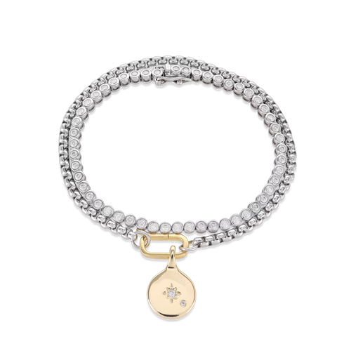 The Tennis and the Box Bracelet Set, a two-piece silver bracelet set featuring a diamond-like tennis bracelet and a box chain bracelet with a gold north star charm accented with diamond-like stones.