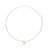 The SOLITAIRE LILY NECKLACE which is a thin mini can opener necklace with a mini diamond flower pendant.