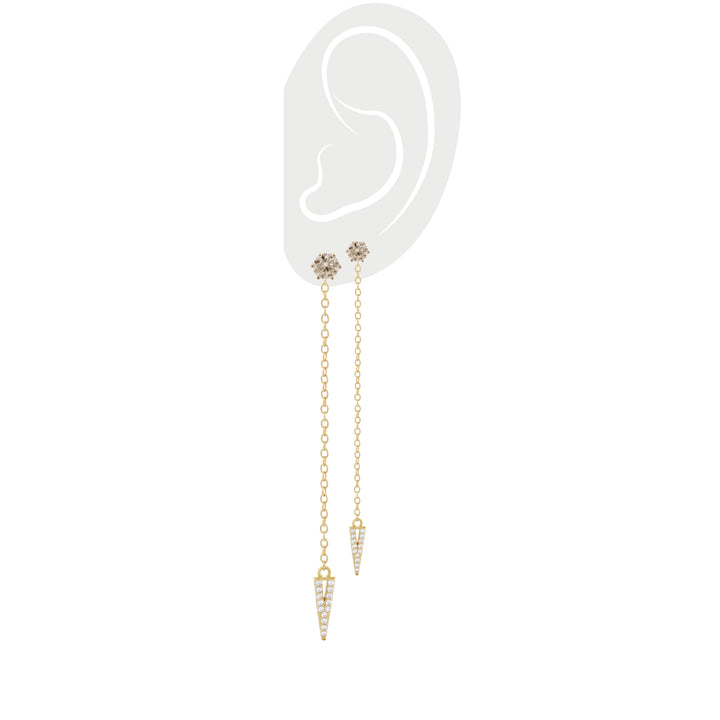 A pair of the Arrow Earring Chain, a single gold chain earring with a V-shaped arrowhead pendant adorned with sparkling stones. ||| GOLD