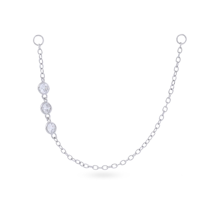 The Trio Diamond Earring Chain, a silver earring chain featuring three sparkling cubic zirconia stones.
