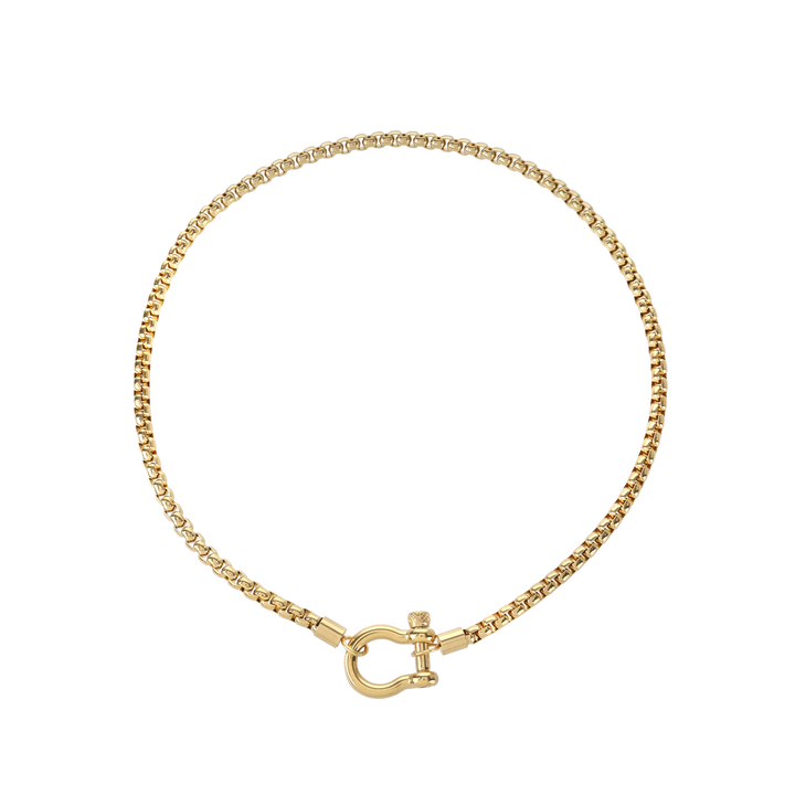The Herradura Necklace, a gold chain necklace with a unique horseshoe-shaped clasp. |||Gold