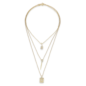 The You and the Needle Necklace Set, a three-piece gold necklace set with a needle pendant and initial charm.