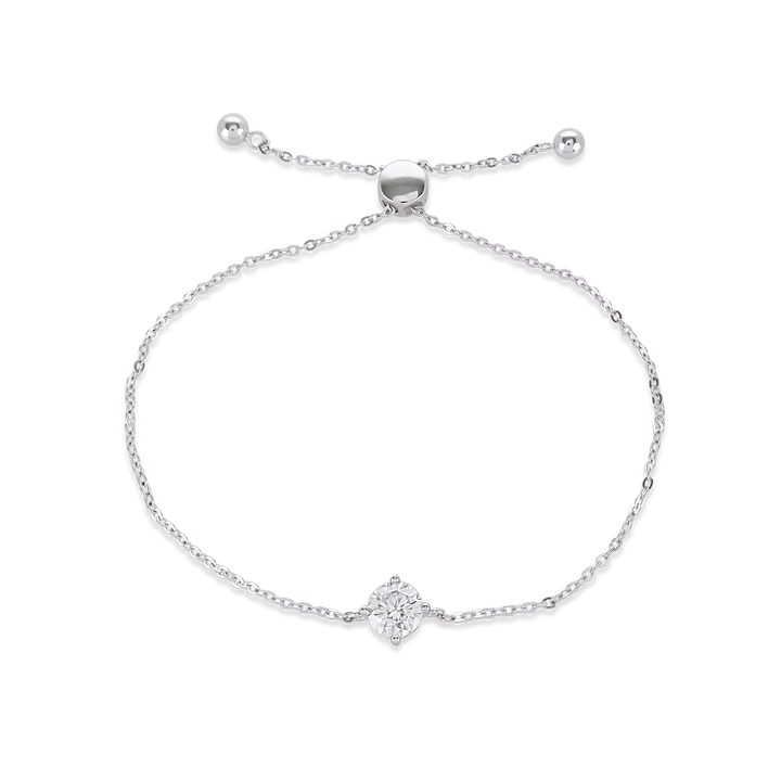 The Solitaire Adjustable Bracelet, a silver adjustable bracelet with a delicate chain and a single diamond-like stone cluster.