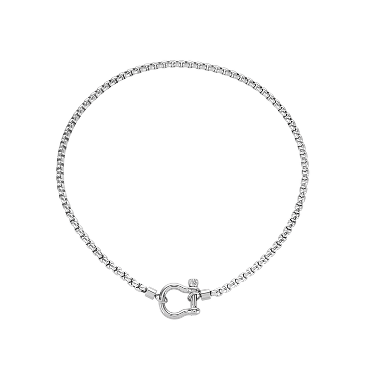 The Herradura Necklace, a silver chain featuring a signature horseshoe clasp with a cubic zirconia accent. ||| SILVER