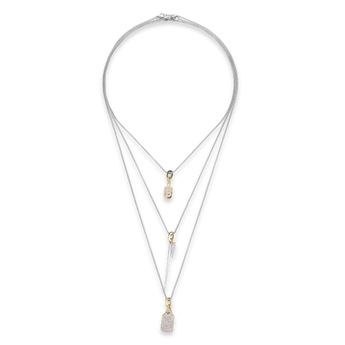 The Tag Needle Necklace Set, a three-piece silver necklace set featuring three chains with two diamond-like encrusted dog tag charms and a spike charm.

