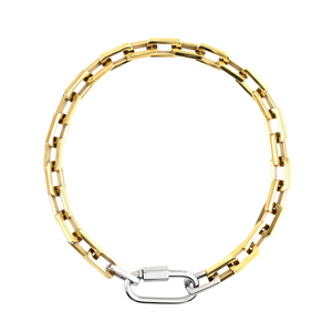 The Carabiner Square Puerto Necklace, which is a striking gold chain necklace featuring a unique silver carabiner clasp.