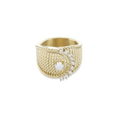 The Abuela ring which is a Gold textured statement ring with diamond accents in a unique wave design.