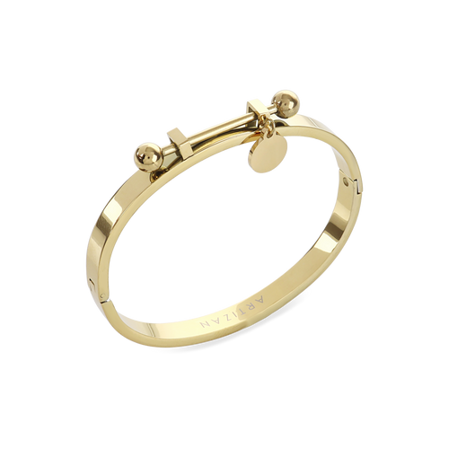 The Coins Bangle, a gold bangle bracelet with a unique toggle closure and a dangling coin charm. ||| GOLD