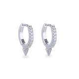 The MINI SHOT HOOP, which is a pair of sleek silver earrings, features a delicate hoop design adorned with sparkling cubic zirconia stones and finished with a pointed charm at the base for a modern edge. Perfect for adding a subtle yet bold statement to any outfit.