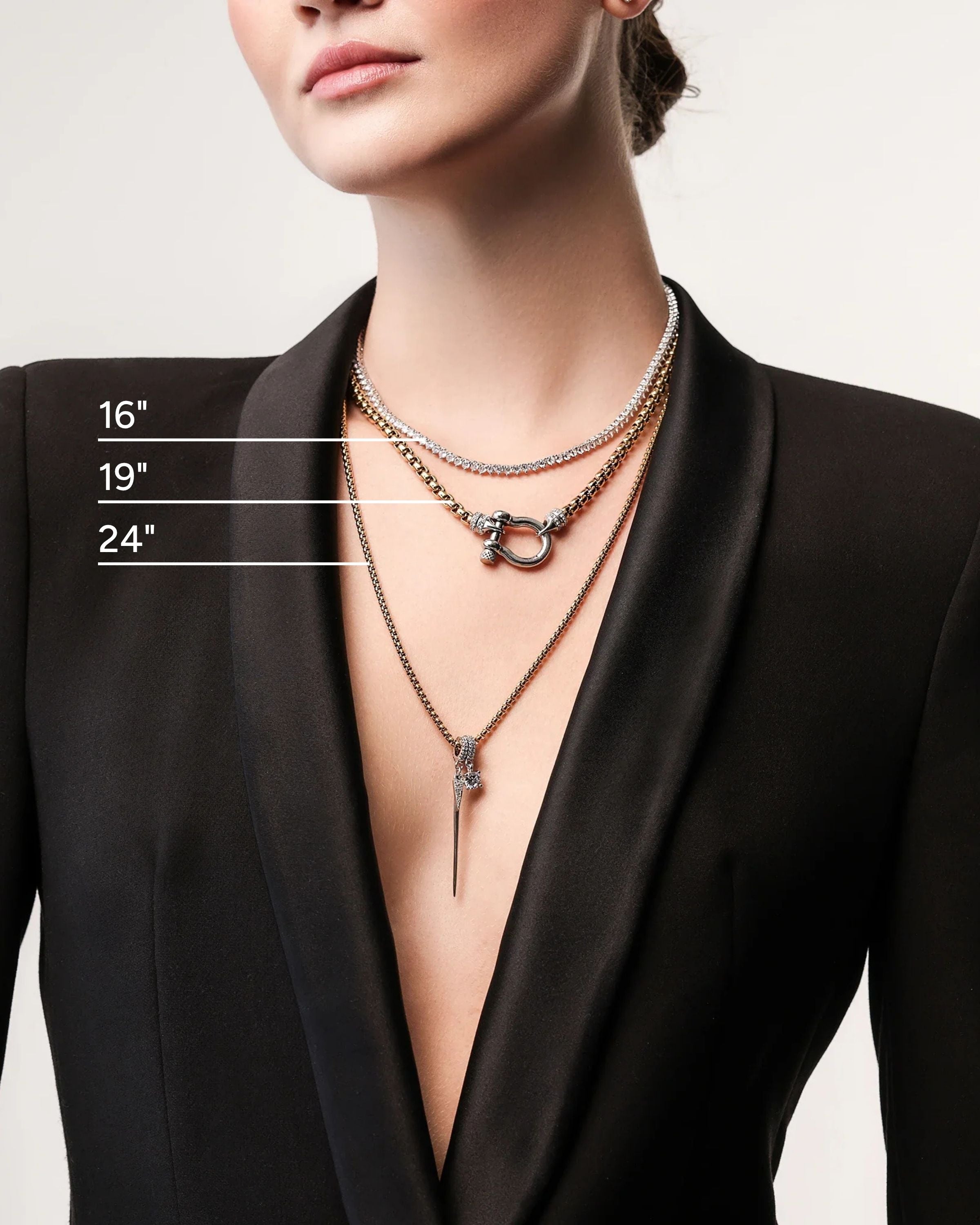 Model wearing the Herradura Signature Spiga Tennis Set, a luxurious layered necklace featuring mixed-metal chains, a tennis necklace, and signature charm details.