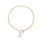 The HERRADURA SIGNATURE DOUBLE TAKE featuring a gold chain with a silver horseshoe clasp and dangling charms, including a pavé bar and a gold star pendant. ||| SILVER