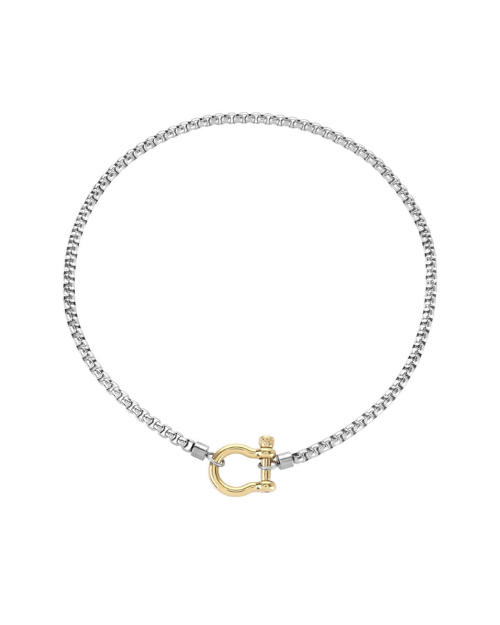 The Herradura Mix Necklace, a silver necklace featuring a box chain with a gold horseshoe clasp. |||Gold
