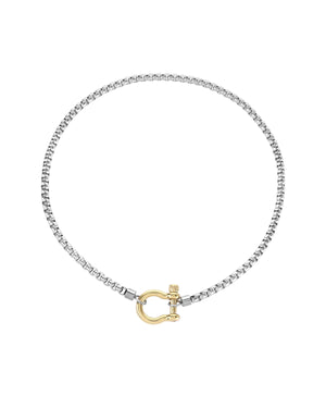 The Herradura Mix Necklace, a silver necklace featuring a box chain with a gold horseshoe clasp. |||Gold