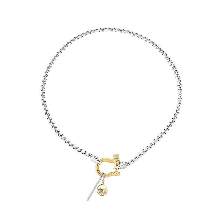 The HERRADURA SIGNATURE DOUBLE TAKE featuring a silver chain with a gold horseshoe clasp and dangling charms, including a pavé bar and a gold star pendant. ||| GOLD