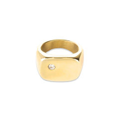 The Y Punto Pinky Ring, a gold pinky ring with a minimalist design and a single cubic zirconia stone.