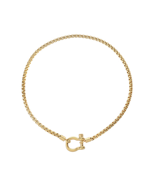 The Herradura Necklace, a gold chain necklace with a unique horseshoe-shaped clasp. |||Gold