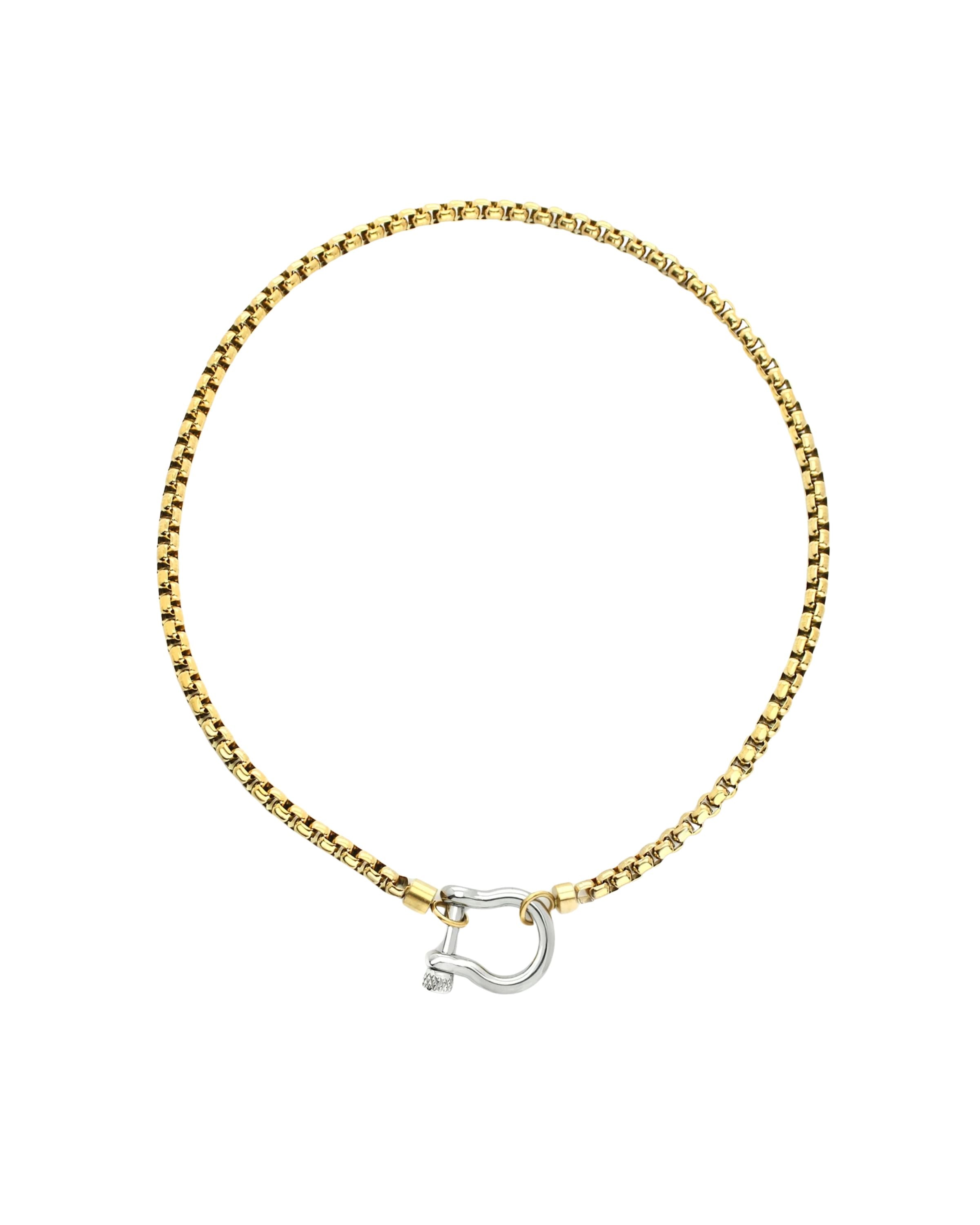 The Herradura Mix Necklace, a gold necklace featuring a box chain with a silver horseshoe clasp. |||Silver