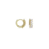 The Tiny Huggies Hoop, a pair of small gold hoop earrings that feature a row of sparkling cubic zirconia stones set in a  pointed, triangular pattern.||| GOLD