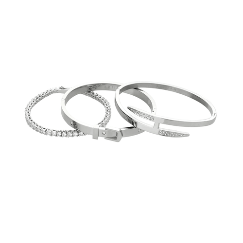 The **Core Stack**, a set of three sleek silver-tone bracelets, includes a sparkling stone bangle, a minimalist cuff, and a modern nail-inspired design, perfect for layering or wearing solo.