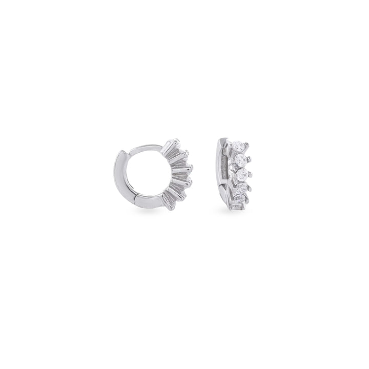 The Tiny Huggies Hoop, a pair of small silver hoop earrings that feature a row of sparkling cubic zirconia stones set in a  pointed, triangular pattern.||| SILVER