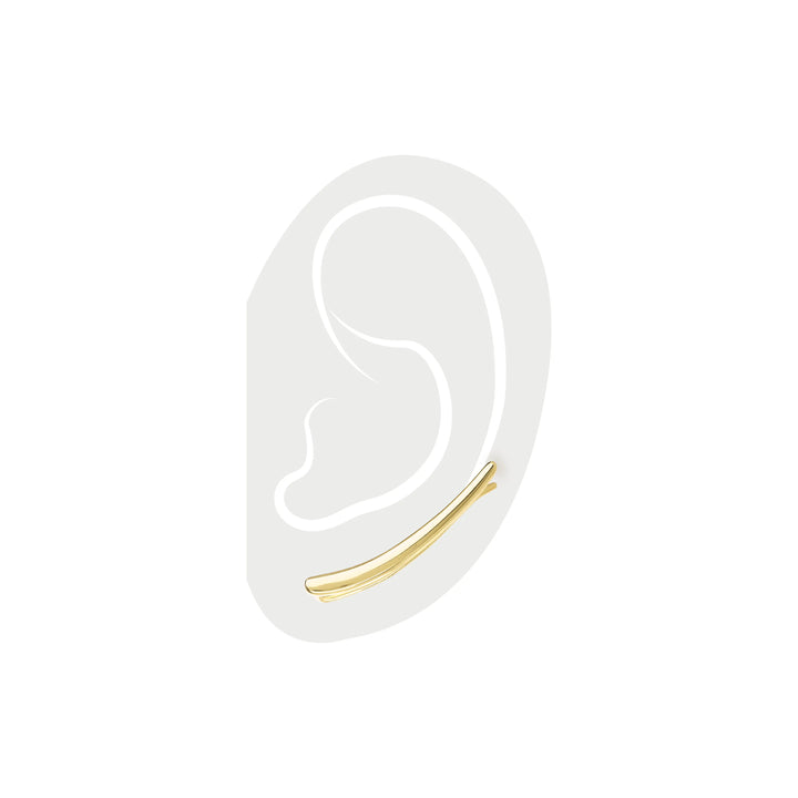 The Line Climber, which is a single-piece gold ear climber earring, features a sleek, minimalist curved design that elegantly traces along the curve of the ear for a chic, modern, and understated statement.