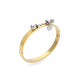 The Coin Bangle is a mixed-metal bracelet featuring a sleek gold band with silver-tone hardware, including a dangling coin charm and bold spherical accents. ||| MIX SILVER