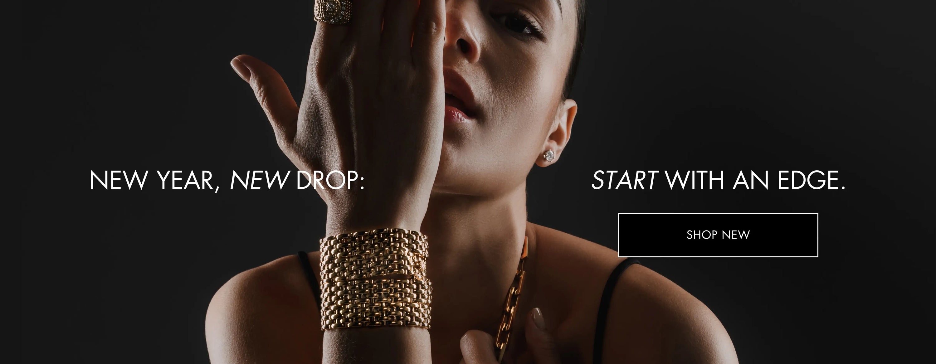 Model wearing Artizan Joyeria's Braided Chain Cuff and Necklace, featuring bold, interwoven gold chains, with the text 'NEW YEAR, NEW DROP: START WITH AN EDGE