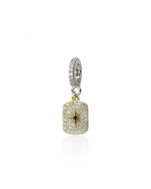 The Celestial Star Clip On Charm, a gold charm with a  star design accented with pave diamonds and a silver clip-on bale.