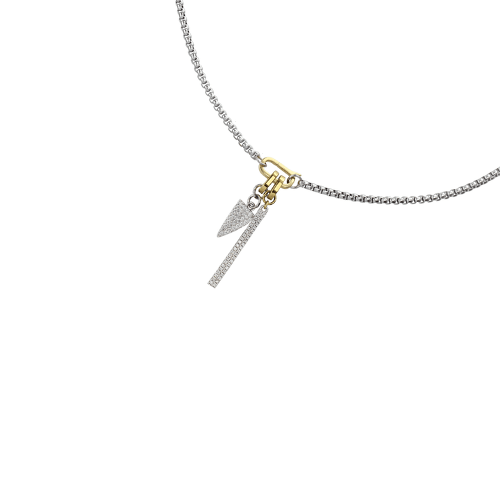 The Link Box Bar Charm Necklace, a silver chain featuring a gold bar and spike charm accented with cubic zirconia.