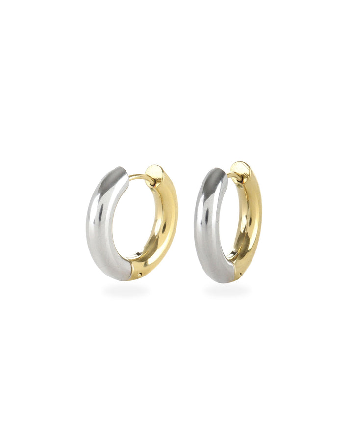 The Slim Mix Huggies, a chic pair of two-tone hoop earrings features a combination of gold and silver tones.