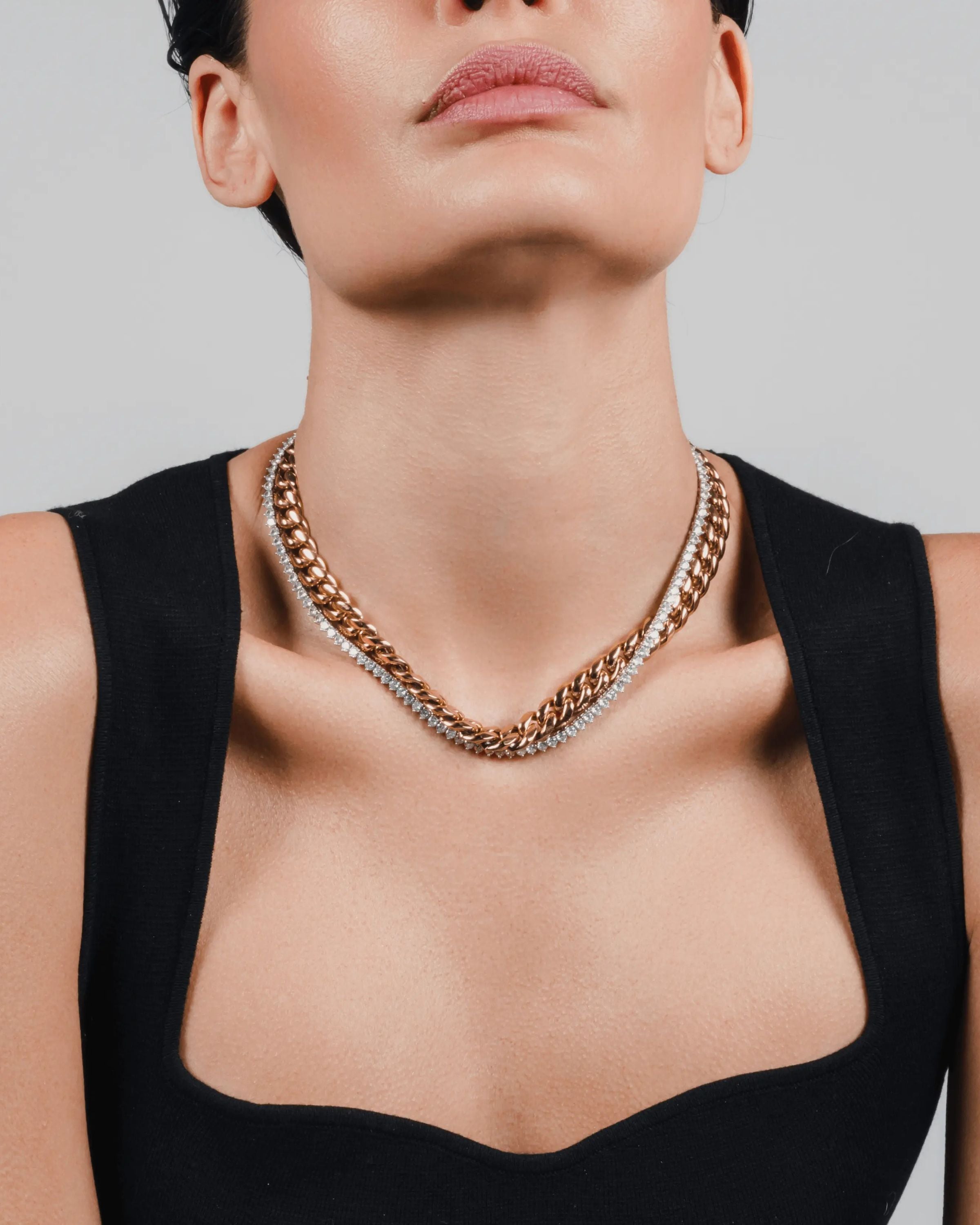 The TENNIS AND THE CURB CHAIN LAYERED NECKLACE SET which is a two-piece layered necklace stack in gold and silver, featuring a curb chain and a tennis chain. ||| GOLD