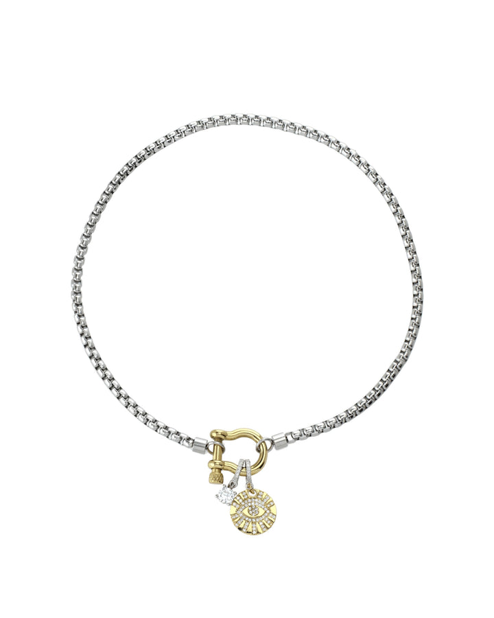 The Herradura Clip On Evil Eye Necklace, a silver and gold necklace featuring a box chain with a gold horseshoe clasp and an evil eye charm accented with diamond-like stones.