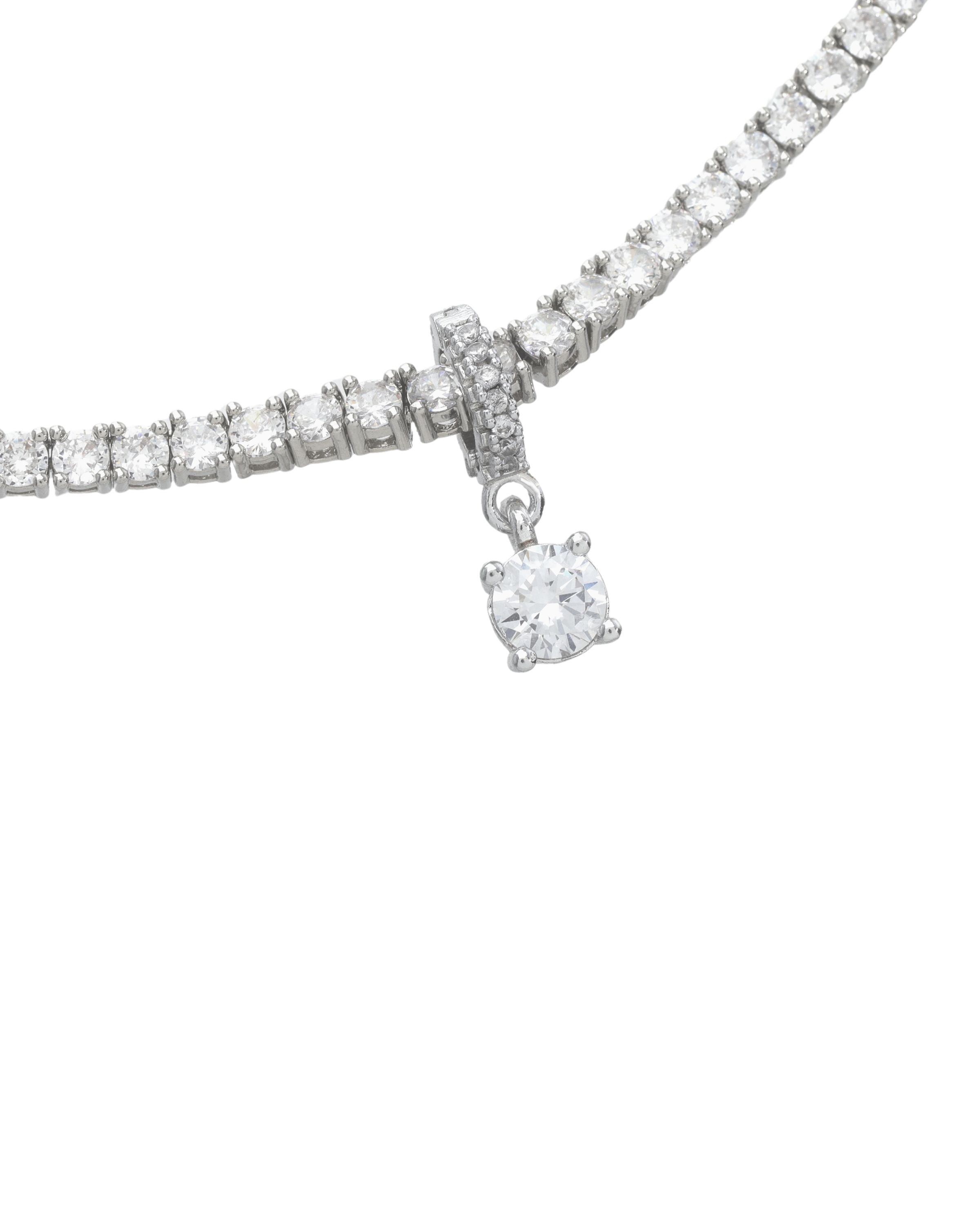 Close-up of the Solitaire Tennis Necklace, which is a single silver necklace with round-cut stones and a center solitaire pendant.