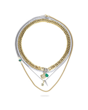 The Just Click Emerald Tennis Necklace Set, a four-piece gold and silver necklace set featuring a variety of chains with diamond-like accents, emerald accents, and a variety of charms.