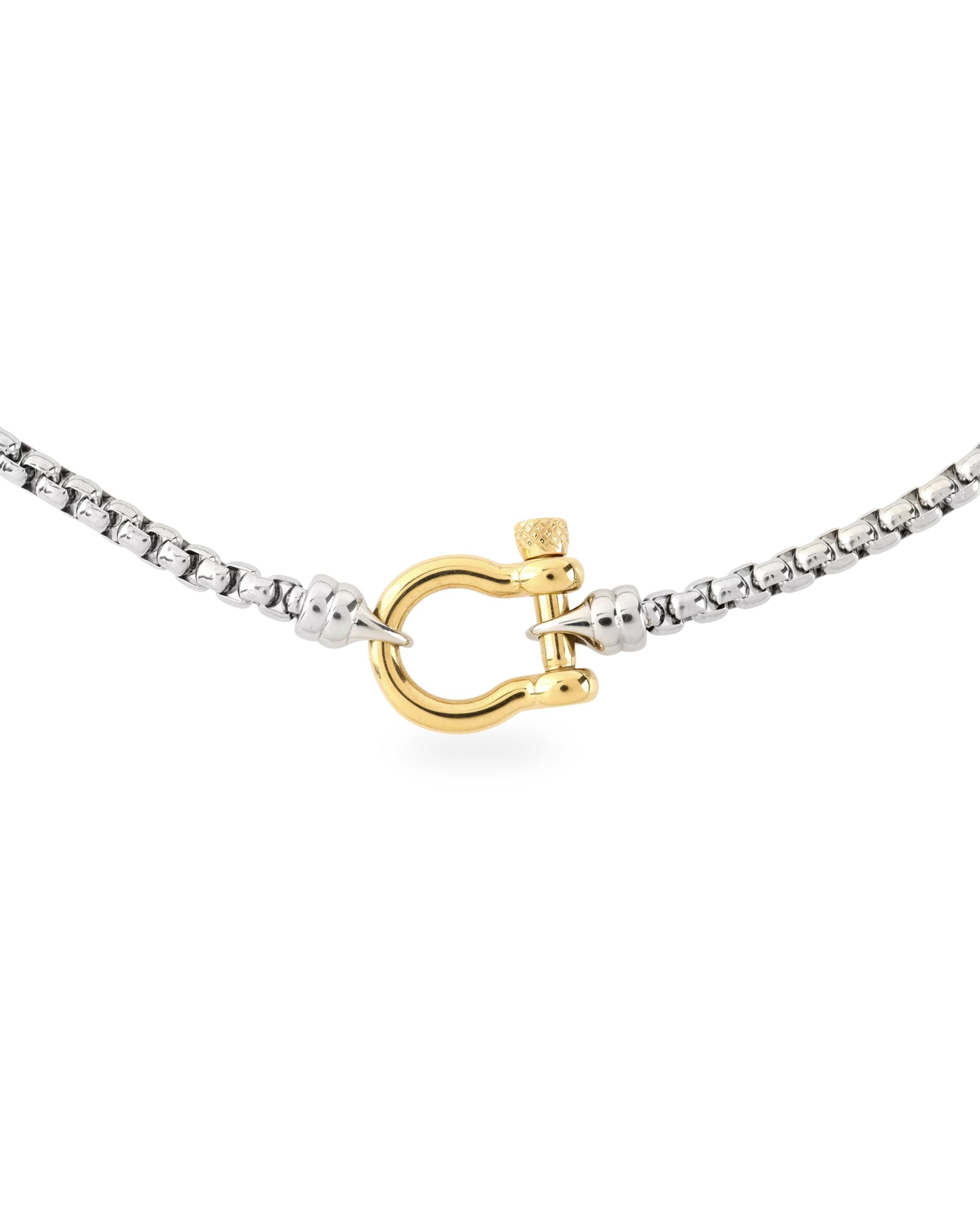 The Herradura Signature Mix, a silver necklace featuring a box chain with a gold horseshoe clasp.||| GOLD