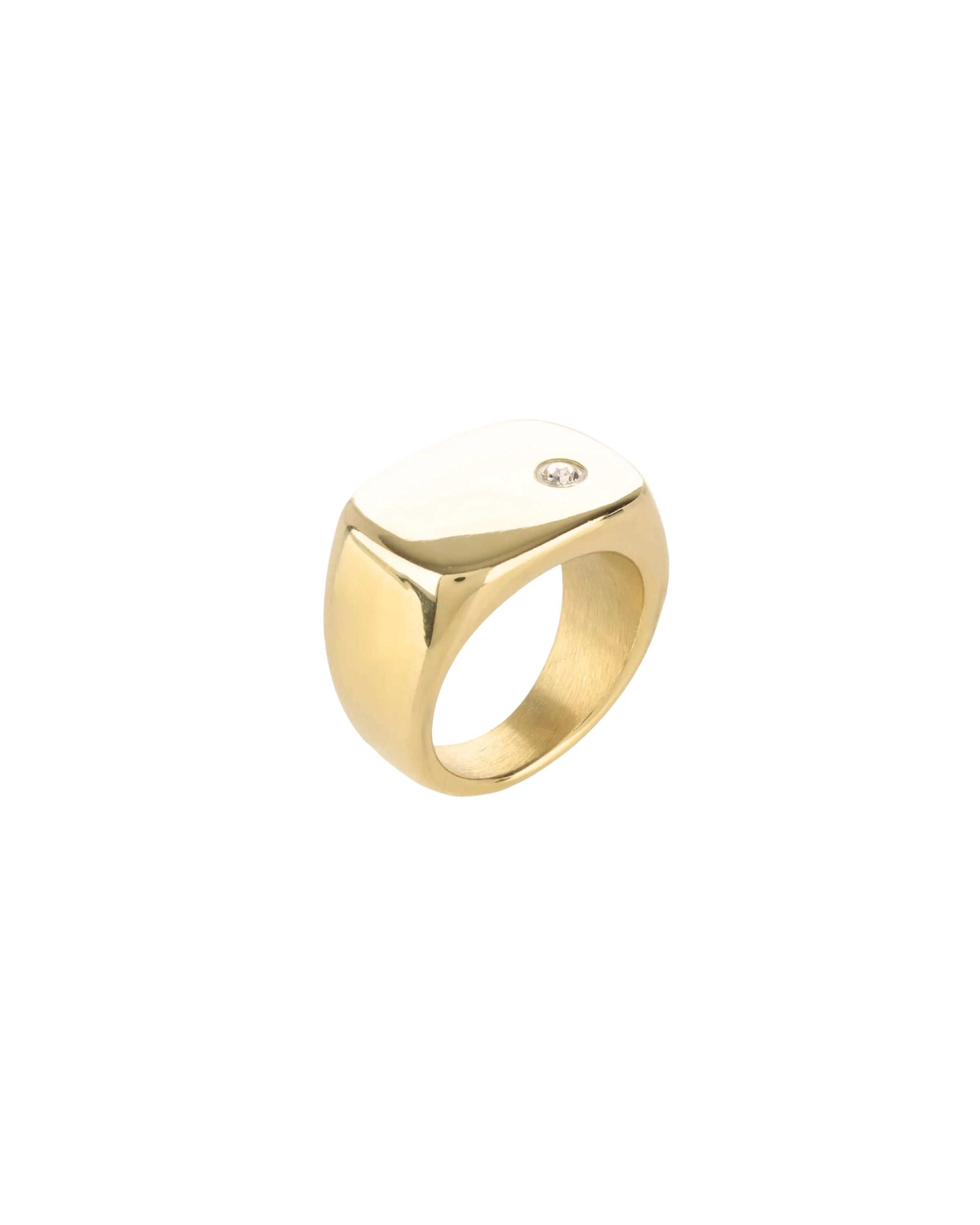 The Y Punto Pinky Ring, a gold pinky ring with a minimalist design and a single cubic zirconia stone.