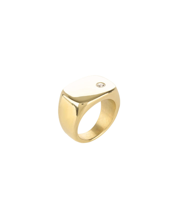 The Y Punto Pinky Ring, a gold pinky ring with a minimalist design and a single cubic zirconia stone.