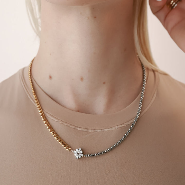 Model wearing the FUSION NECKLACE is made of mixed Stainless steel chain and18k gold plated cuban chain connected with a Sterling Silver rhombus shaped zirconia charm. ||| MIX