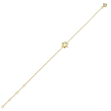 The Fine Guiding Star Bracelet, a delicate gold chain bracelet featuring a star-shaped charm encrusted with sparkling crystals. This elegant piece adds a touch of celestial-inspired beauty, perfect for wearing alone or layering with other bracelets for a stylish, meaningful look.